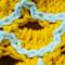 A close up of a scale on the yellow scarf option.